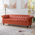 Divano Chesterfield a 3 posti con braccioli arrotolati