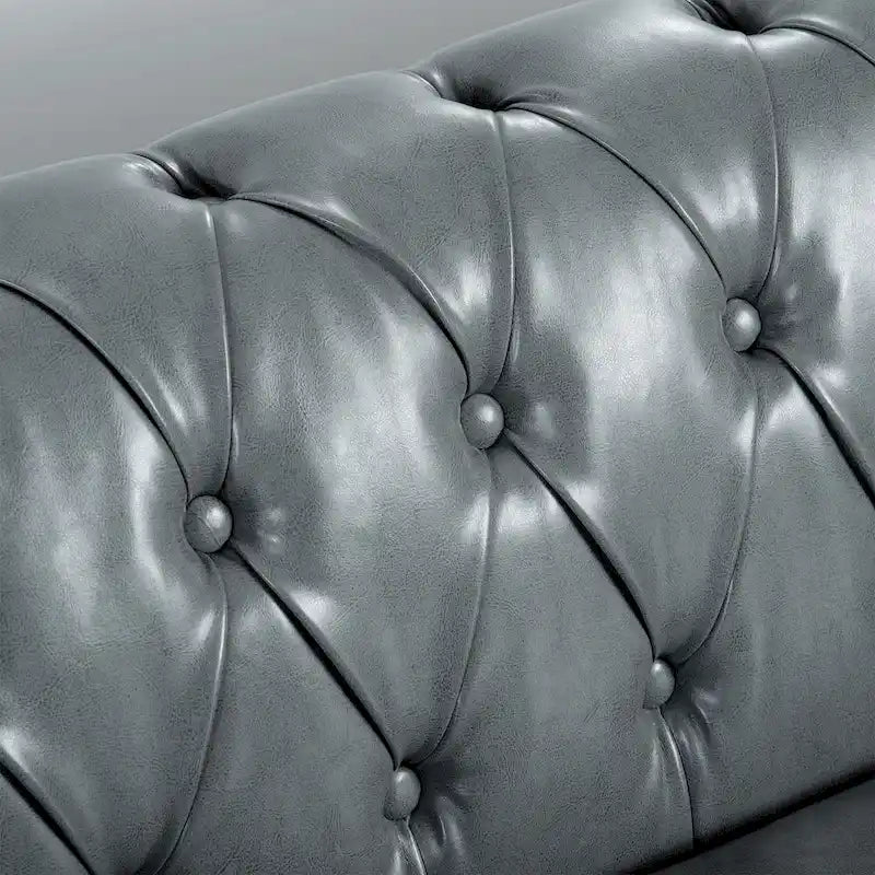 Divano Chesterfield a 3 posti con braccioli arrotolati
