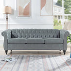 Divano Chesterfield a 3 posti con braccioli arrotolati