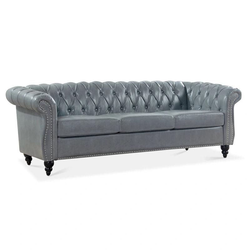 Divano Chesterfield a 3 posti con braccioli arrotolati
