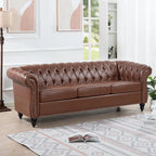 Divano Chesterfield a 3 posti con braccioli arrotolati