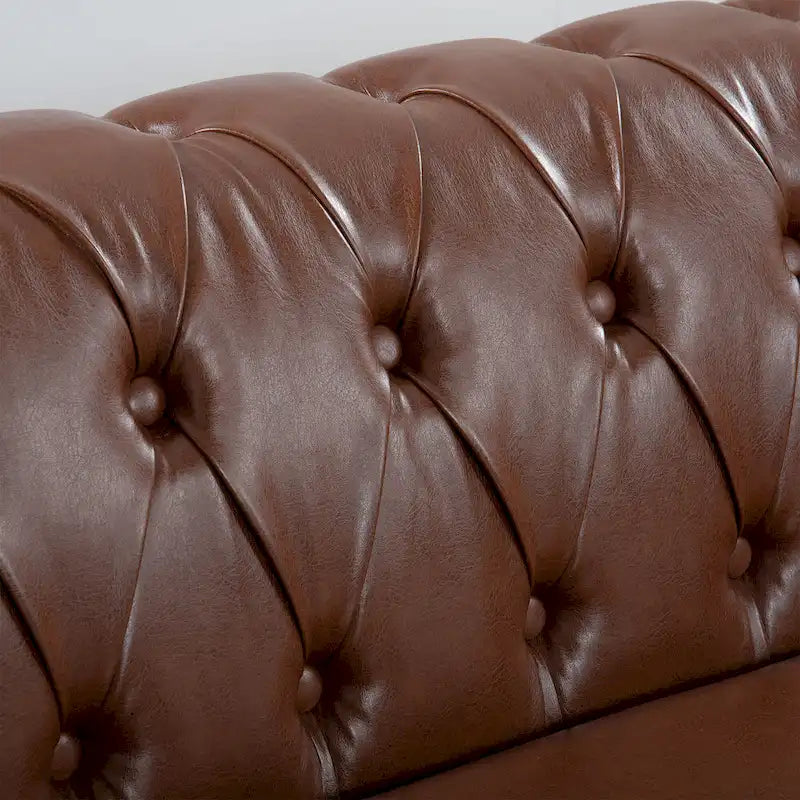 Divano Chesterfield a 3 posti con braccioli arrotolati